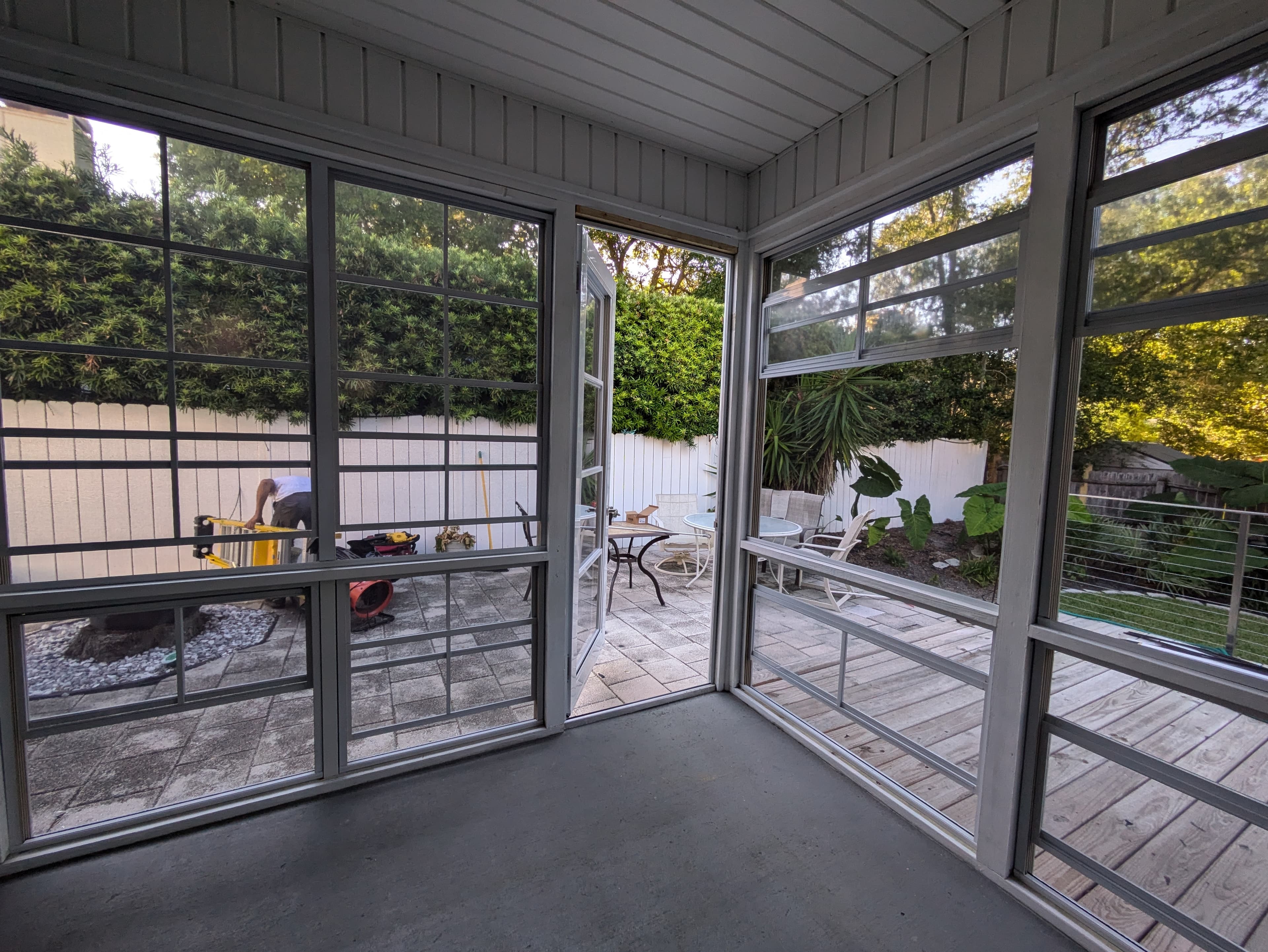 NKO Sunrooms owner installing a Sunspace WeatherMaster door on a Jacksonville porch